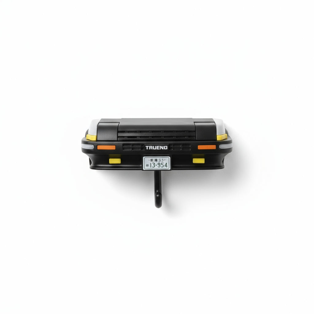 Wieszak na klucze w kształcie samochodu z otwieranymi reflektorami